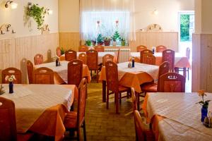 a dining room filled with tables and chairs at Farm Stay Pri Cepčovih in Golac