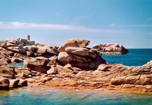 a group of rocks on the shore of the ocean at Ty Moon in Lannion