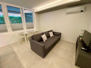 Posezení v ubytování NEW Residenza le Essenze - i 7 Laghi