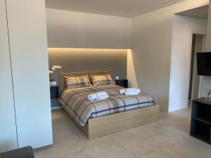 Postel nebo postele na pokoji v ubytování NEW Residenza le Essenze - i 7 Laghi
