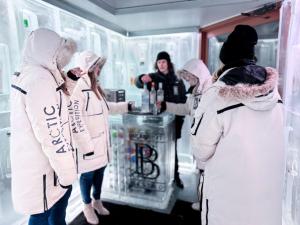 a group of people standing in front of a refrigerator at Listel Whistler, a Coast Hotel in Whistler