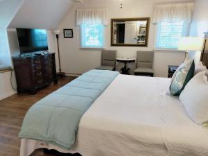 Un ou plusieurs lits dans un hébergement de l'établissement Cherokee Lodge