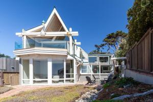 a large white house with a large window at chenxiao in Moody
