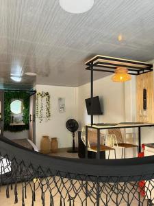 a living room with a table and a dining room at Refugio verde, interior 2 in Acacías