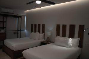 Katil atau katil-katil dalam bilik di Hotel B10 - Distinctive Hotel-