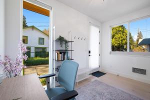 a dining room with a table and a window at Wallingford Getaway in Seattle