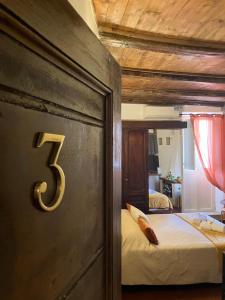 Posteľ alebo postele v izbe v ubytovaní Campo De Fiori - Casa Pettinari 78