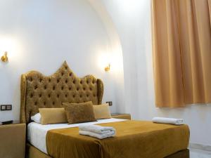 Rúm í herbergi á Hotel Palace tanger