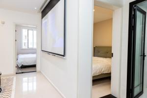 Llit o llits en una habitació de Aurora B&B