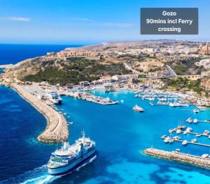 a view of a harbor with boats in the water at Country View Retreat in Żabbar