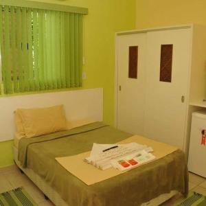 Katil atau katil-katil dalam bilik di Pousada Ondas do mar Maranduba