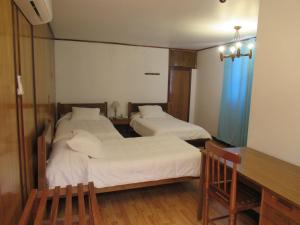 Postel nebo postele na pokoji v ubytování Hotel Vegas