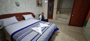 Hostal Private-Lima Aiport客房内的一张或多张床位