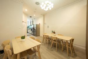 a dining room with wooden tables and chairs at Urban Nomad Potts Point - 18 to 39 only in Sydney