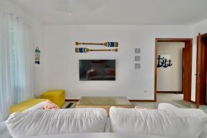 Ένα ή περισσότερα κρεβάτια σε δωμάτιο στο Oceanfront Apt W- Private Beach - Las Terrenas