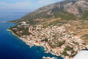 an aerial view of a small town on a mountain at Family friendly house with a swimming pool Bol, Brac - 23787 in Bol