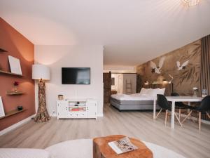 TV a/nebo společenská místnost v ubytování Casa del Mar Zandvoort