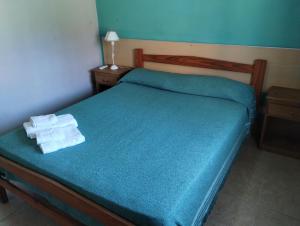 a bedroom with a bed with two towels on it at Hotel rural Concordia in Concordia +19 photos