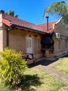 a house with a picnic table in front of it at Hotel rural Concordia in Concordia