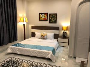Postel nebo postele na pokoji v ubytování Longs Beach House - Wonderland Hồ Tràm + 30 fotografií