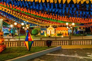 a colorful kite is standing in front of a building at Flat em Bananeiras - PB in Bananeiras +5 photos