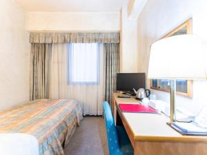 Postel nebo postele na pokoji v ubytování Tabist Hotel Mercury Asakusabashi