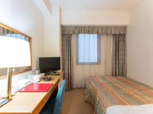 Postel nebo postele na pokoji v ubytování Tabist Hotel Mercury Asakusabashi