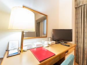 TV a/nebo společenská místnost v ubytování Tabist Hotel Mercury Asakusabashi