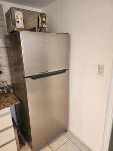 a stainless steel refrigerator in a kitchen at Dúplex céntrico en capital in Mendoza