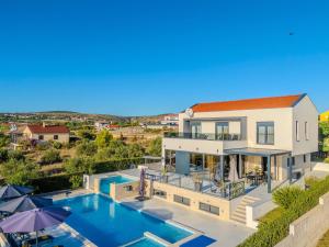 an aerial view of a house with a swimming pool at Modern villa with private swimming pool in Vrana +32 photos