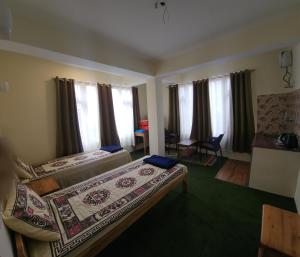 Katil atau katil-katil dalam bilik di Dolma's Homestay