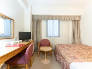 Postel nebo postele na pokoji v ubytování Tabist Hotel Mercury Asakusabashi