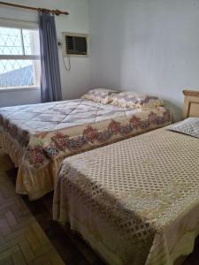 Postel nebo postele na pokoji v ubytování Pousada casa dos sonhos para argentinos