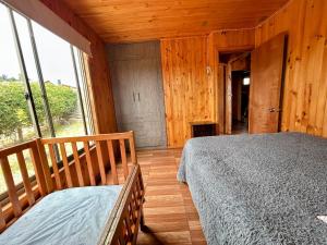 Postel nebo postele na pokoji v ubytování Cabaña en chovellen