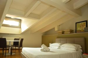 Katil atau katil-katil dalam bilik di Locanda Blum In