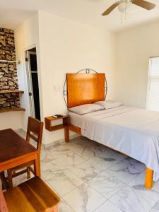 Voodi või voodid majutusasutuse Buenosdías Izamal toas