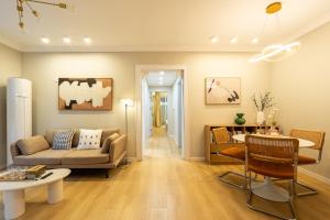 a living room with a couch and a table at Shanghai Hills&Linghu's Transit-Prime Suite-Line 2, Huamu Rd 788, Direct to Key Spots & SNIEC in Shanghai