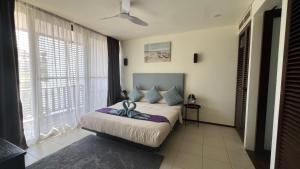 Ένα ή περισσότερα κρεβάτια σε δωμάτιο στο Bang Tao Garden Beach - Penthouse +21 φωτογραφίες