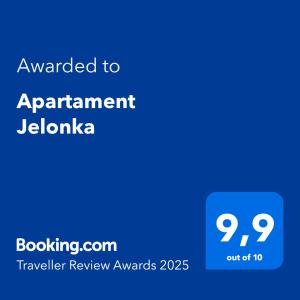 a blue sign with the text awarded to apartment jolanda at Apartament Jelonka in Jelenia Góra