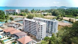 an aerial view of a building and the ocean at Mantra Condo M168 in Ban Phlong Sawai