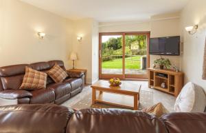 Televiisor ja/või meelelahutuskeskus majutusasutuses Red Deer Cottage - Wheddon Cross