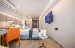 Ένα ή περισσότερα κρεβάτια σε δωμάτιο στο Yunbo Hotel