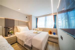 Ένα ή περισσότερα κρεβάτια σε δωμάτιο στο Yunbo Hotel