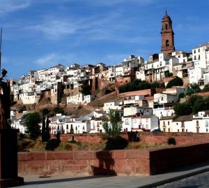 a group of white buildings on a hill at Casa Chacha Tere in Montoro