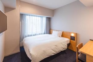 Postel nebo postele na pokoji v ubytování Sotetsu Fresa Inn Kyoto-Kiyomizu Gojo