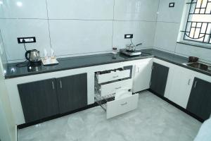 a bathroom with a sink and a toilet in it at TPK Residency in Thanjāvūr