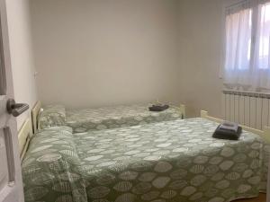 Postel nebo postele na pokoji v ubytování Las Hadas Albergue -solo para Peregrinos - Vegano -Bar