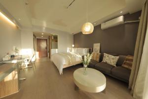 Ліжко або ліжка в номері Shanghai Suju Service Apartment Pudong Wanda Plaza Zhoupu Subway Station Branch