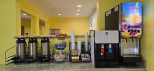 a store with a drink dispenser next to at Desert Inn Tucumcari in Tucumcari