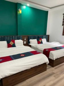Postel nebo postele na pokoji v ubytování Harmony Haven Hotel + 10 fotografií